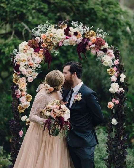 burgundy and blush wedding ceremony decoration
